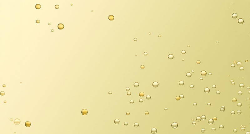 Yellow liquid with bubbles forming.